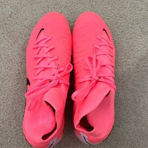 NEVER WORN!! Pink Nike Elite women’s cleats. Very comfy and super durable.